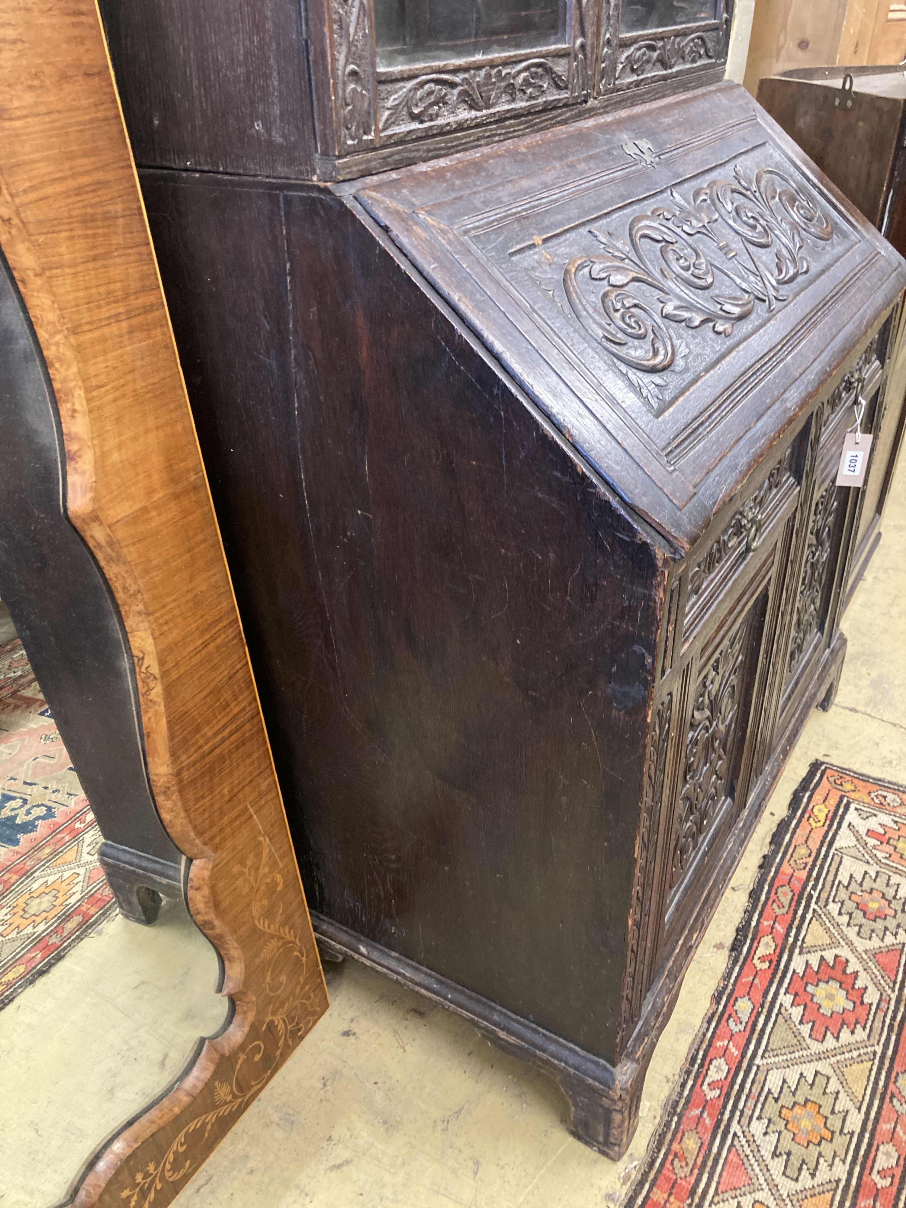 A Victorian carved oak bureau bookcase, width 94cm, depth 54cm, height 203cm